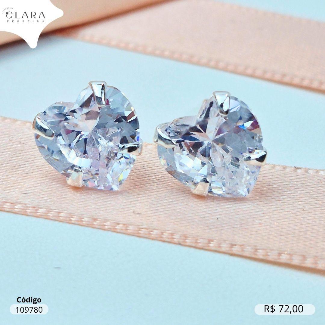 BRINCO SOLITARIO ZIRCONIA CORAÇÃO 10MM BASE 4 GARRAS CAIXA BAIXA - Banho de Prata
