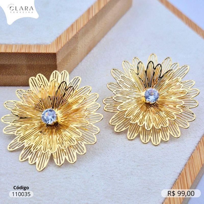 BRINCO FLOR VAZADA LISA C/ MIORLO ZIRCONIA REDONDA 5MM CAIXA COROA 6 GARRAS - 40MM - Dourado