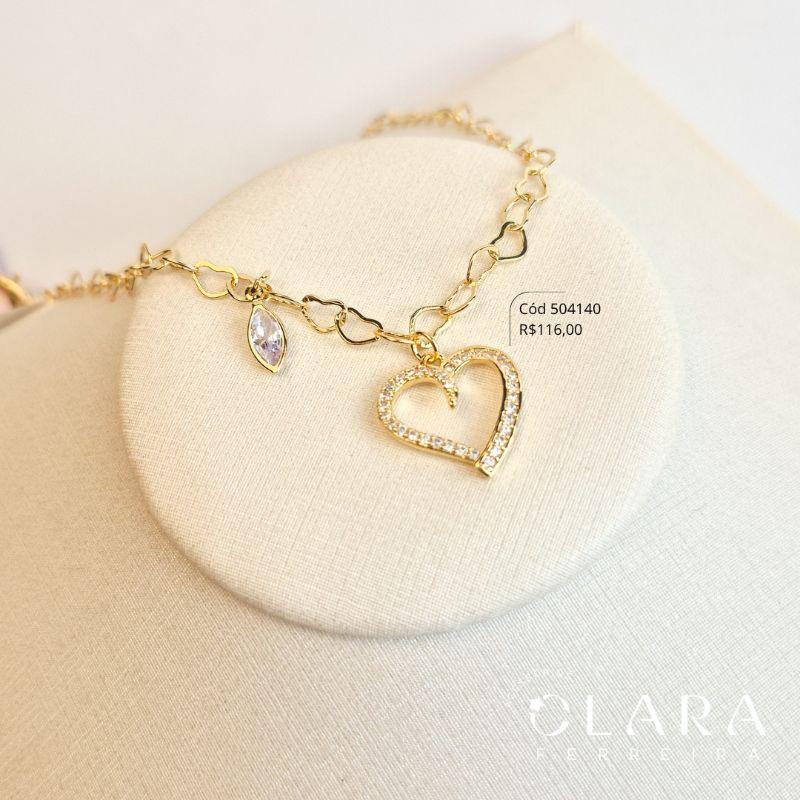 PULSEIRA ELOS CORAÇÕES ENTRELAÇADOS C/ PINGENTE CORAÇÃO MICROZIRCÔNIAS VAZADO E 1 TIFFANY NAVETE 7MM PENDURADOS - 17CM - Dourado - LIMITADA