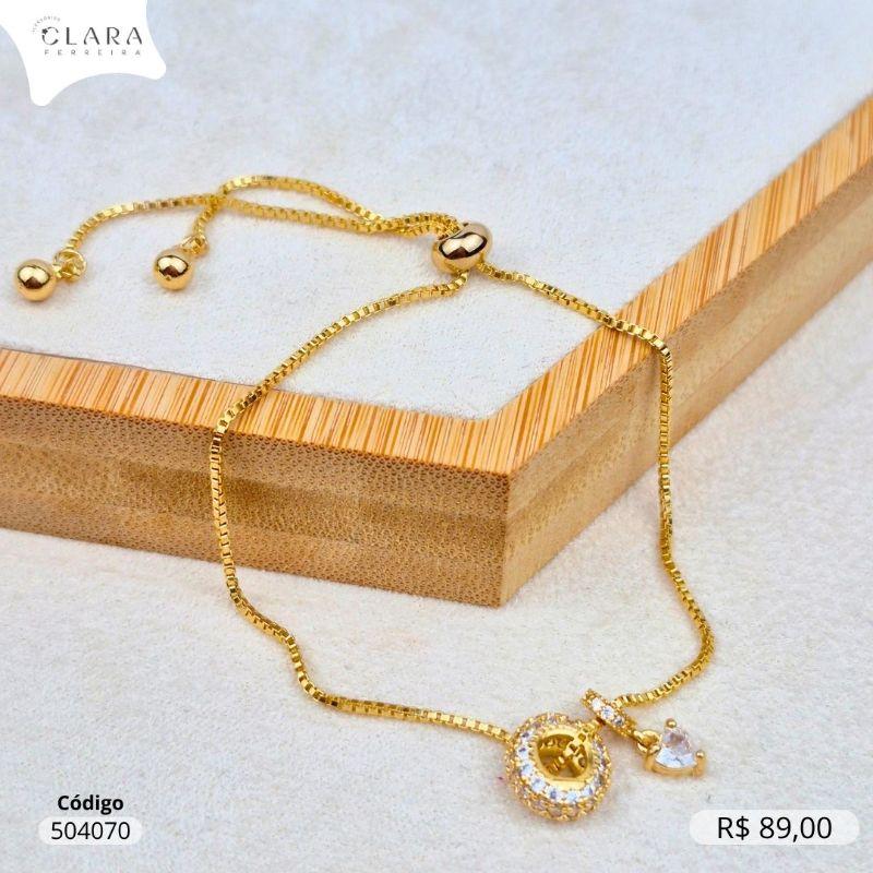 PULSEIRA AJUSTAVEL VENEZIANA C/ 1 SEPARADOR 3 FILEIRAS MICROZIRCÔNIAS E 1 SEPARADOR 1 FILEIRA MICROZIRCÔNIAS C/ ZIRCÔNIA CORAÇÃO 4MM PENDURADA - Dourado