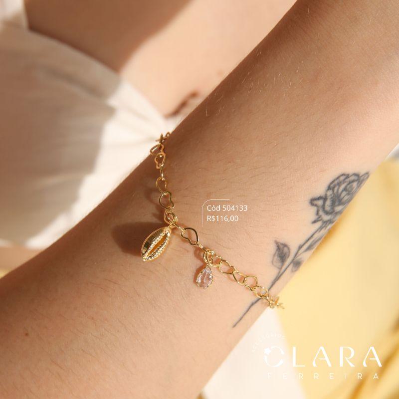 PULSEIRA ELOS CORAÇÕES ENTRELAÇADOS C/ PINGETE BUSIOS LISO 11MM E 1 TIFFANY GOTA 5MM PENDURADOS - 17CM - Dourado