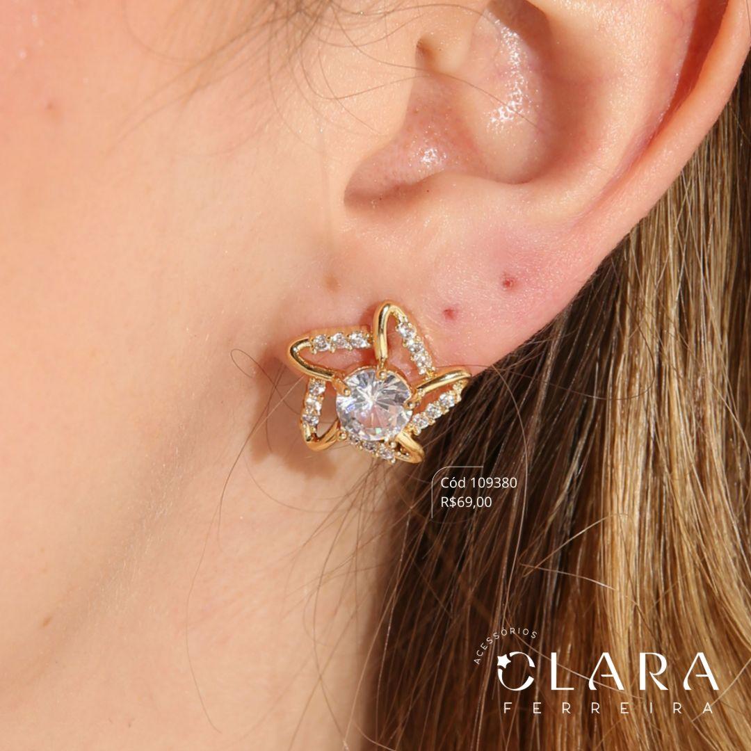 BRINCO ESTRELA MICROZIRCONIAS VAZADA C/ ZIRCONIA REDONDA 6MM NO MEIO - 16MM - Dourado